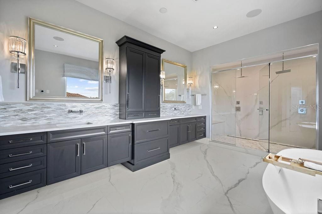Dual sinks, abundance of storage space and a huge walk in shower complete with dual rain water heads, glass doors and excellent lighting.