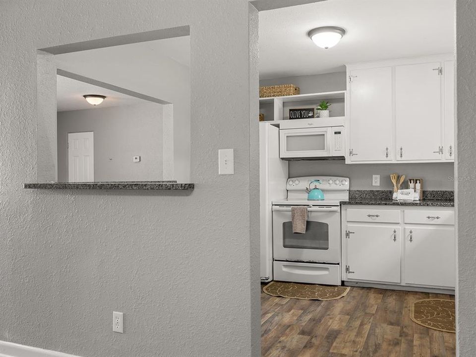 Spacious kitchen with space for small dinette or extra storage.