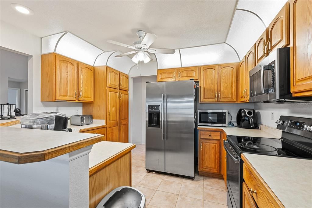 All stainless appliances with convection oven and all wood cabinetry