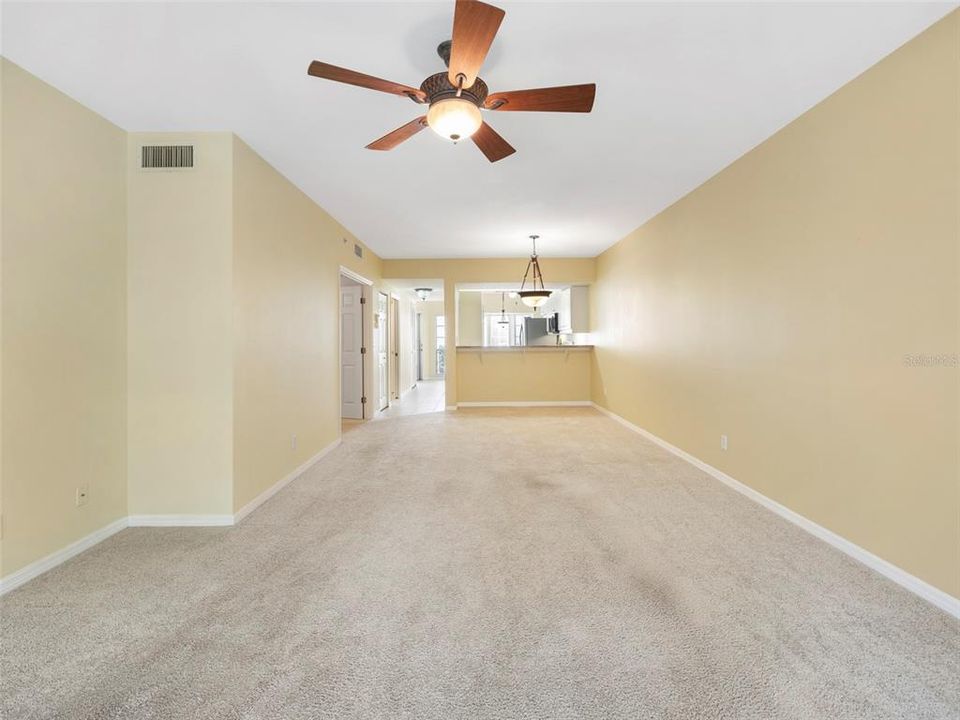 Living room looking back to kitchen and foyer