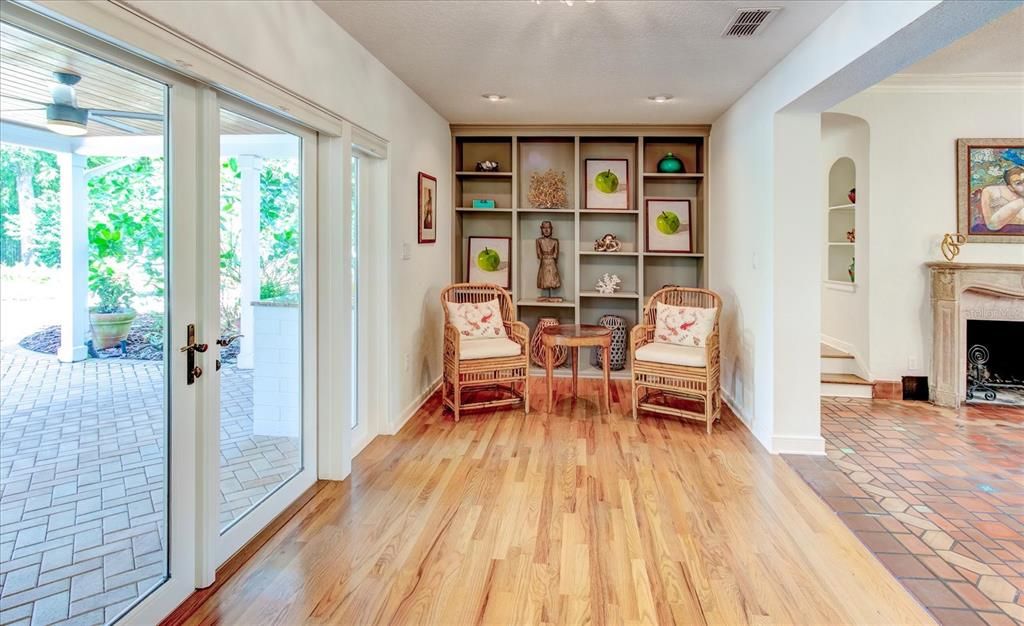 Library area which leads to porch and outdoor kitchen.