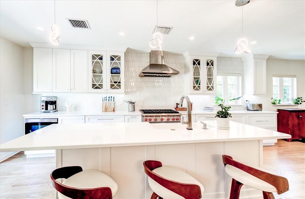 View of kitchen with quartz counters and Omega cabinetry.