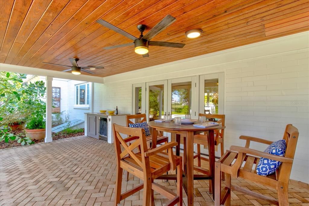 Large entertaining space looking out on pool and lake.