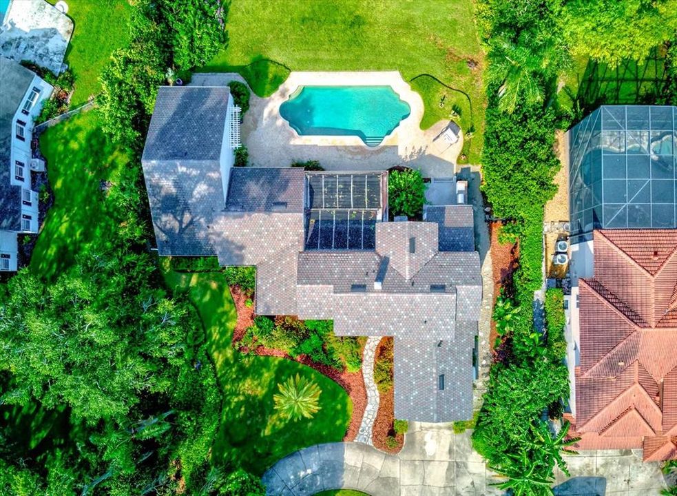 Aerial view of home and pool area.