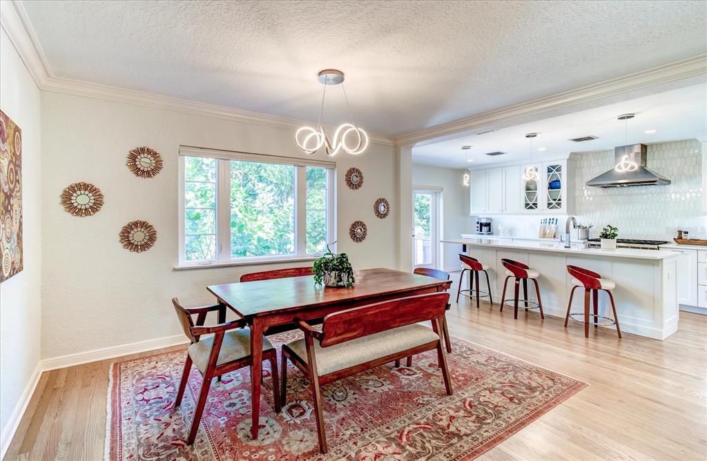 Large eat in kitchen with view of backyard and lake.