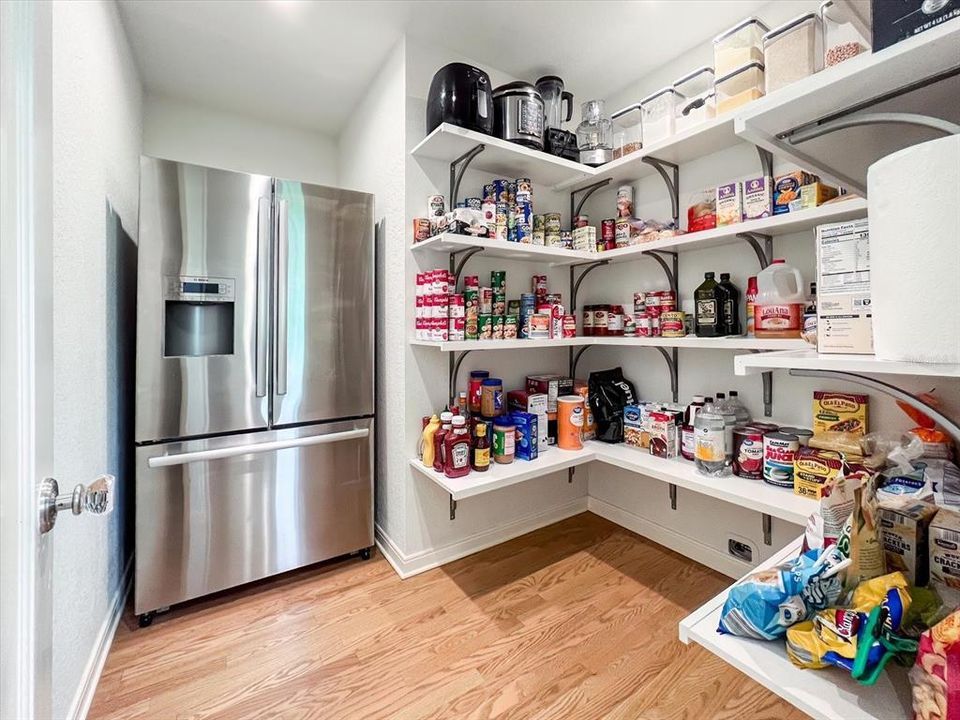 Large pantry with extra refrigerator.
