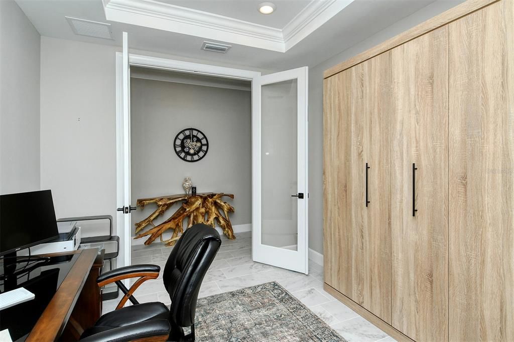 Murphy bed and French doors to hallway