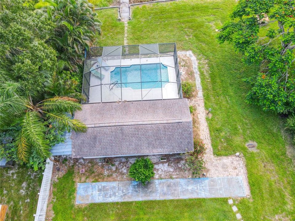 Detached IN-LAW SUITE (included in square footage) providing 510 square feet of living space which includes a private entrance from the pool area and offers a living room, plus the 4th bedroom and 3rd bath