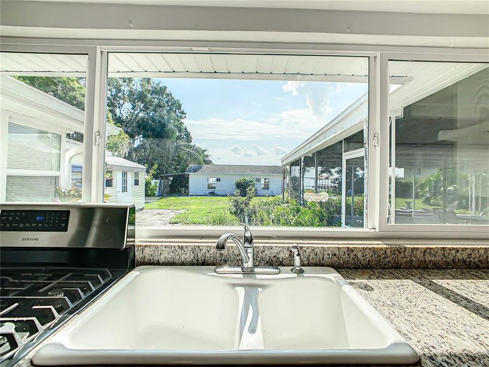 Kitchen window looks to the back yard and Lake Reedy.