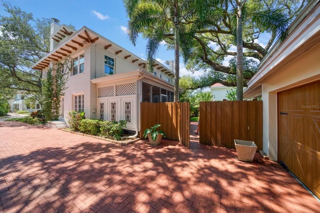 Driveway to 2 Car Garage and Backyard