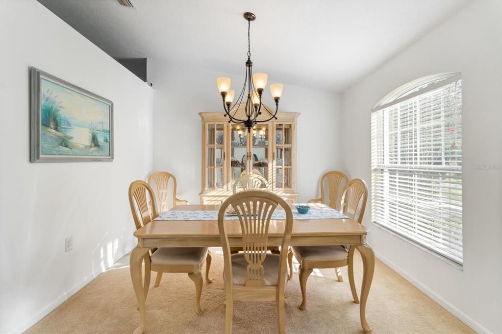 Formal Dining Room w/ Vaulted Ceiling & Plant Shelf