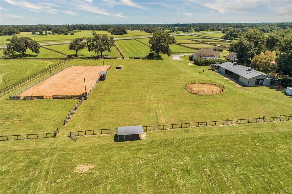 View of 100' x 200' Arena, 12 Acre Pasture,  Main Barn, 60' Round Pen & RV Hookups