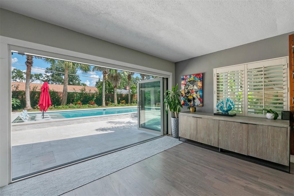 Accordian Folding Glass Doors to the Pool Deck