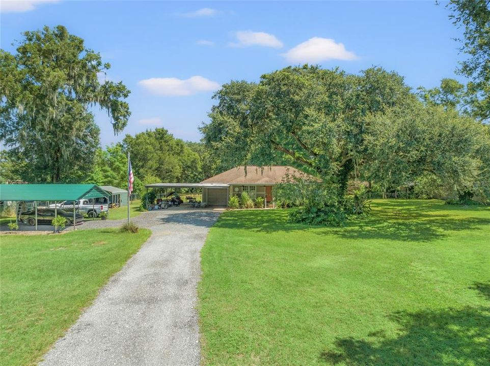 Your own piece of paradise! Driveway as you enter the electronic gate to the home