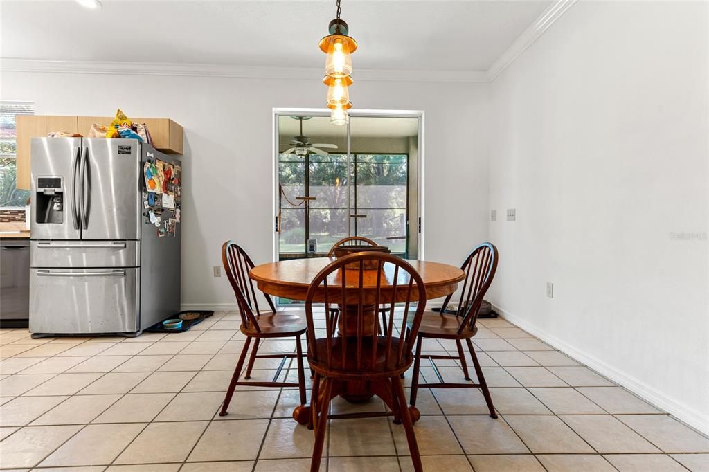 Large Dining Room with views through the glass double doors and screened back porch