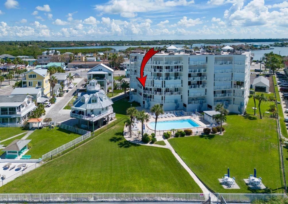 Views of beach and pool from balcony.