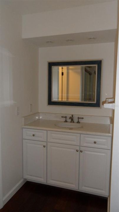 Updated vanity with marble top and recessed lighting in the en-suite bathroom of the 2nd master bedroom