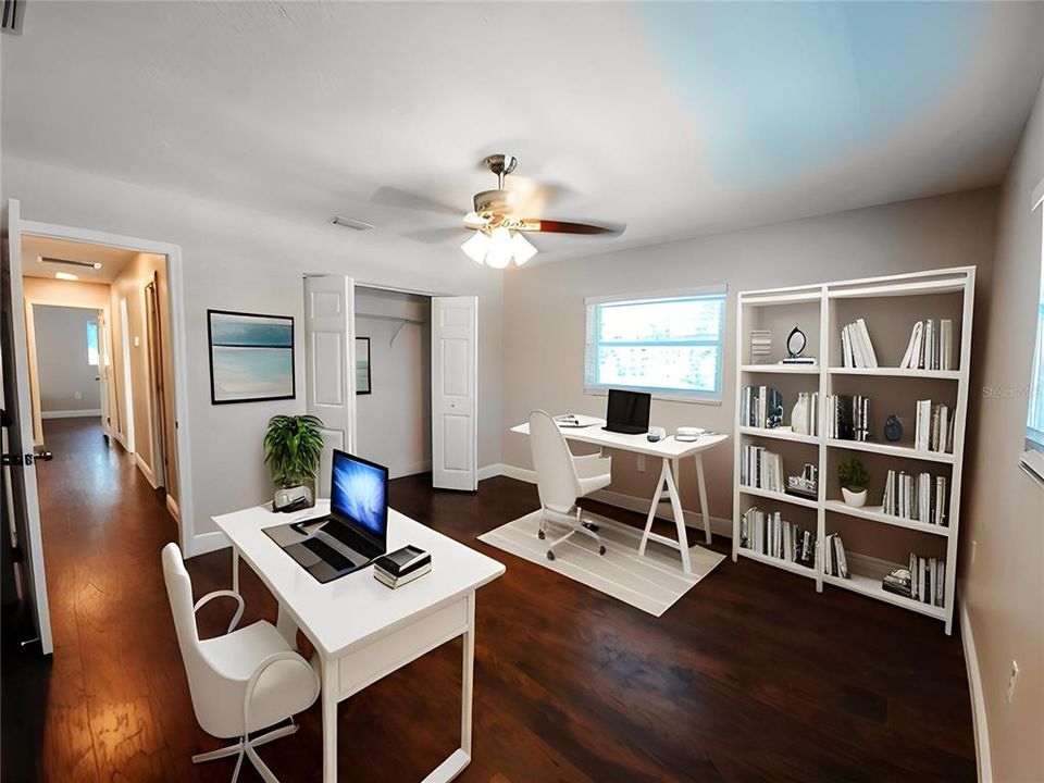 Bedroom 4 is 12 x 12 at the end of the hall Staged here as a home office