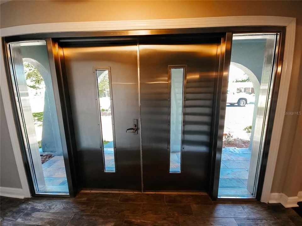 No one will forget the double Stainless Steel Front Doors with Sidelights!!!  Can you say signature piece!