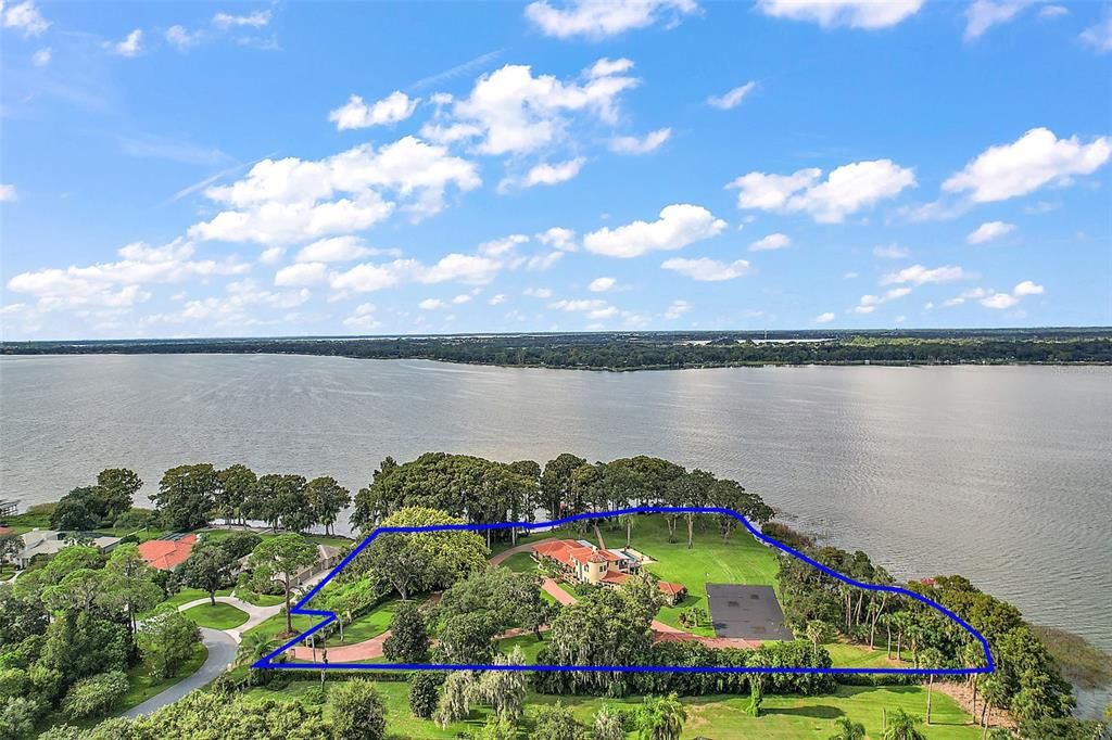 The property encompasses 3.5 acres, as well as the parcel to the East, .42 acres, totaling just under 4 acres of Lake Dora frontage!