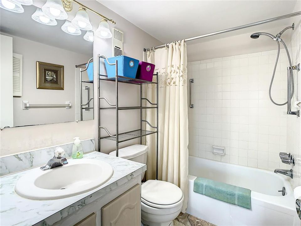 Master bathroom with a tub and shower