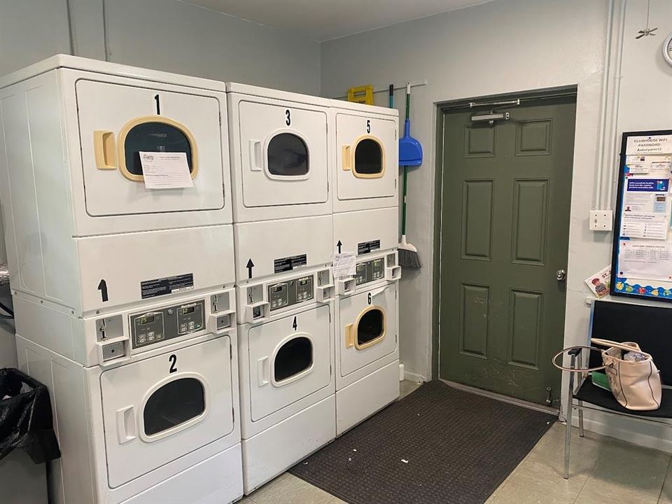 Another view of the dryers in the laundry room at Asbury Arms