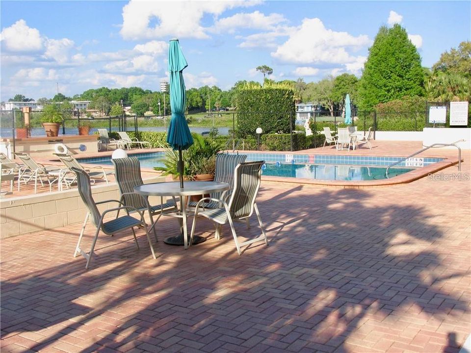 Swimming pool with patio furniture