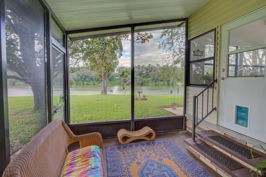 Enclosed porch with view of the lake.