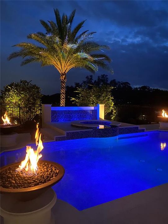 Pool is Outlined with Natural Gas Fire Features and Atmosphere Mode Lighting