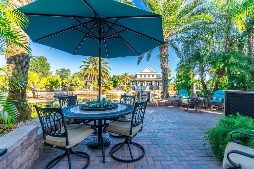 The outdoor patio furniture and umbrella will convey