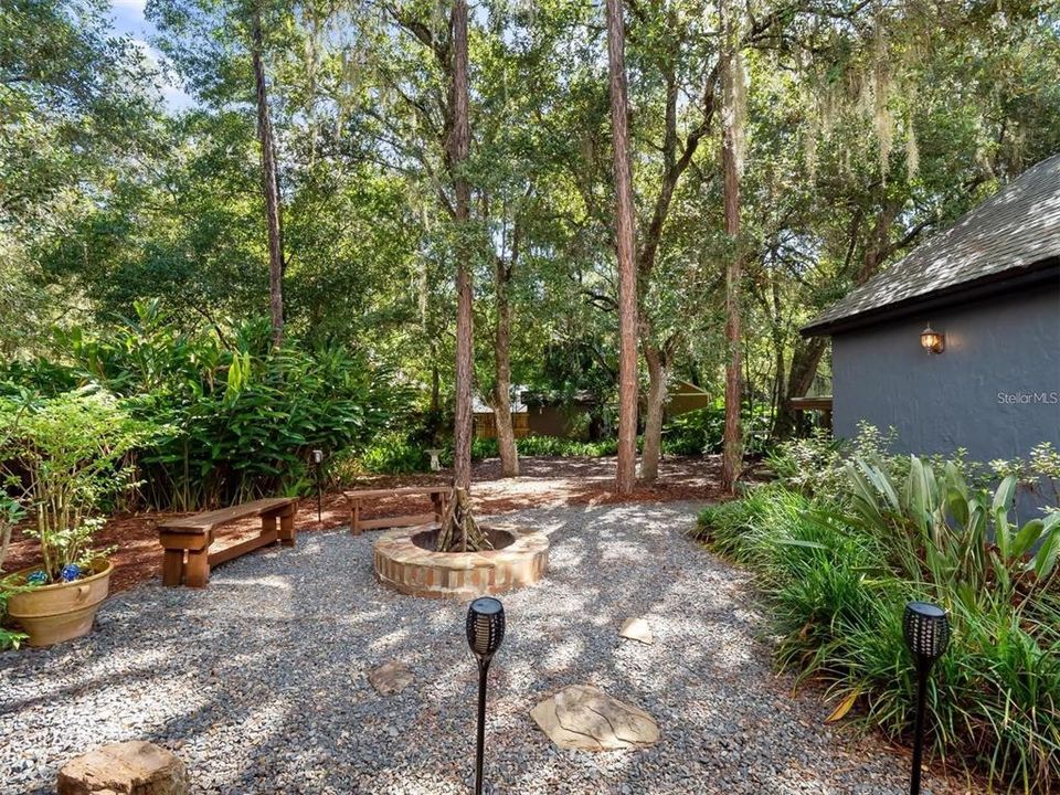 Expansive xeriscape outdoor living space with fire pit and great for grilling