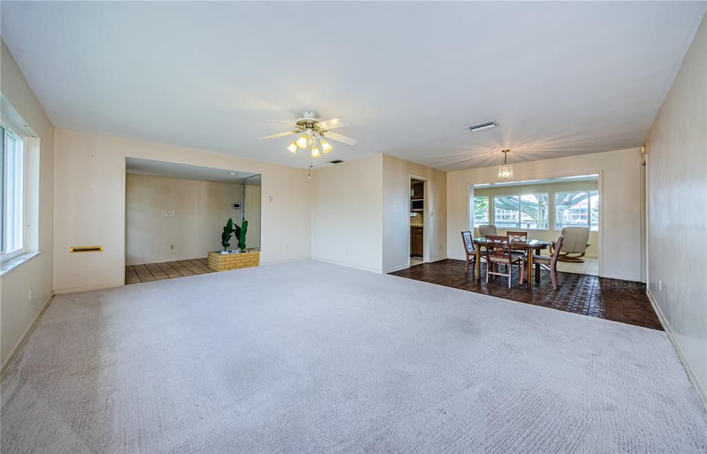 Living room, entry foyer, dining room and family room at the back of the home.  Water view is great!