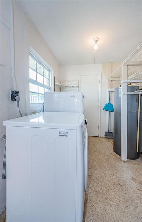 Laundry space in garage, could be enclosed and/or added to the 3rd bathroom space...