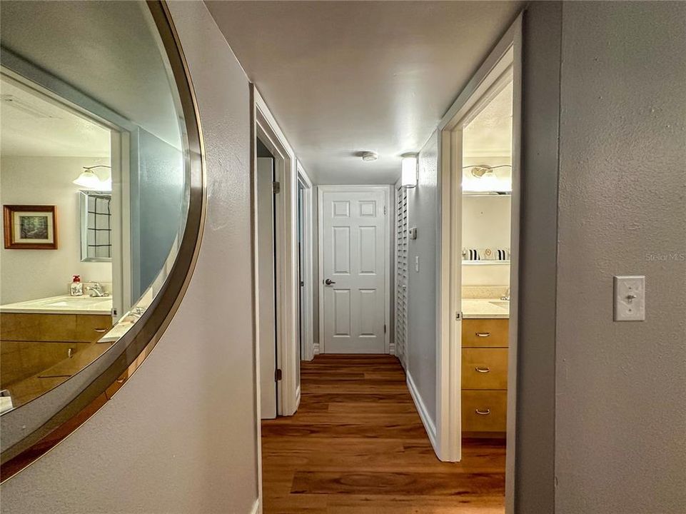 View of hallway towards guest bath, guest bedroom, master suite and extra storage closet