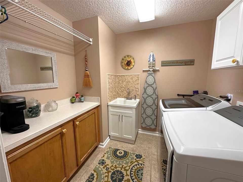 Large laundry room with folding counter & sink