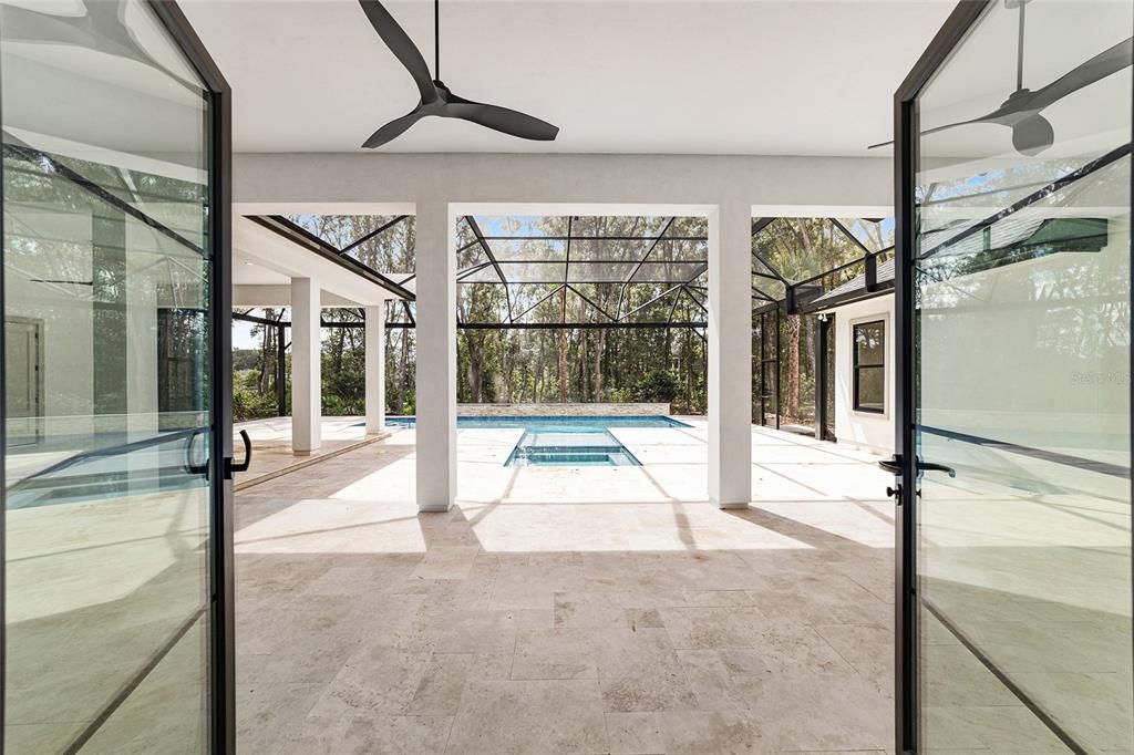 DOORS FROM GREAT ROOM ONTO LANAI AND POOL AREA