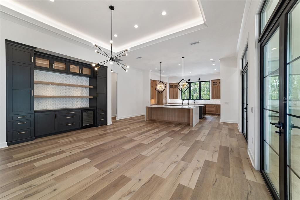 DINING AREA WITH BUILT-INS WITH UNDER COUNTER FRIG AND DESIGNER LIGHTING - NOT VIRTUALLY STAGED