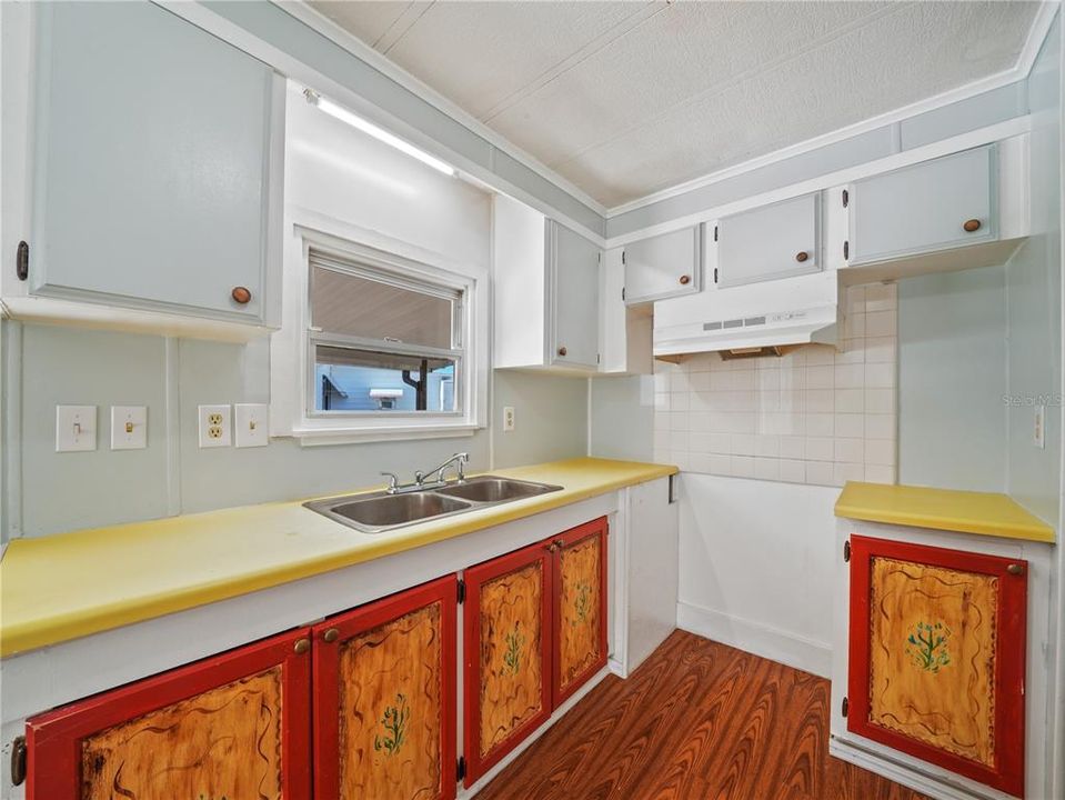 The kitchen has double sinks and overlooks the carport.