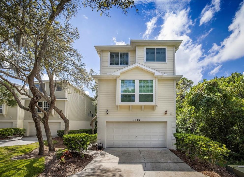 Welcome to 1345 Curlew Road, a detached townhome just minutes to Honeymoon Island!