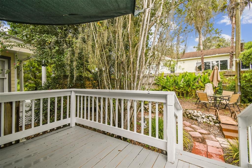 Porch off Sunroom leads to Pond/courtyard area