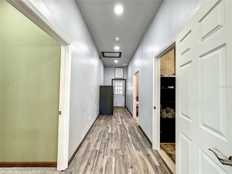 Hallway with door leading to the attached garage.