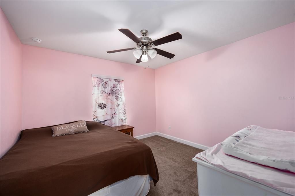 Second guest bedroom with walk in closet.