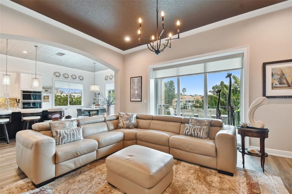 Family room with sliders and views of the lush landscaping