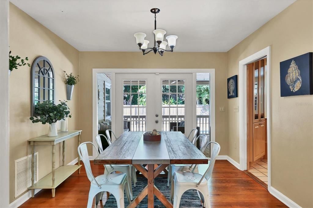 Dining Room with French Doors to covered deck and pool