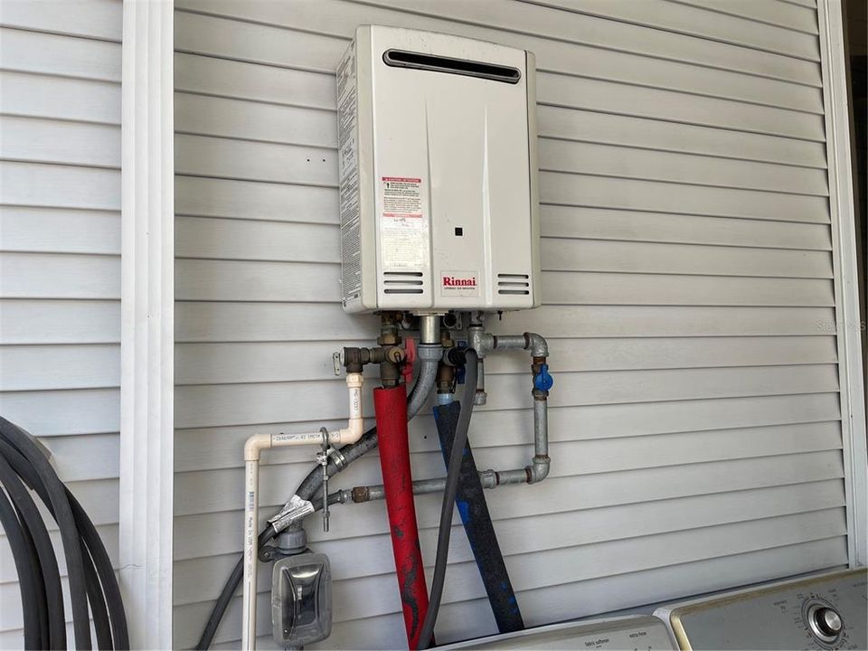 Tankless water heater is on the back covered porch. Washer and dryer stays also.
