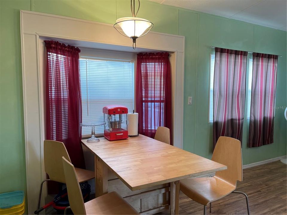 Dining space has bay window. Walls were recently painted.