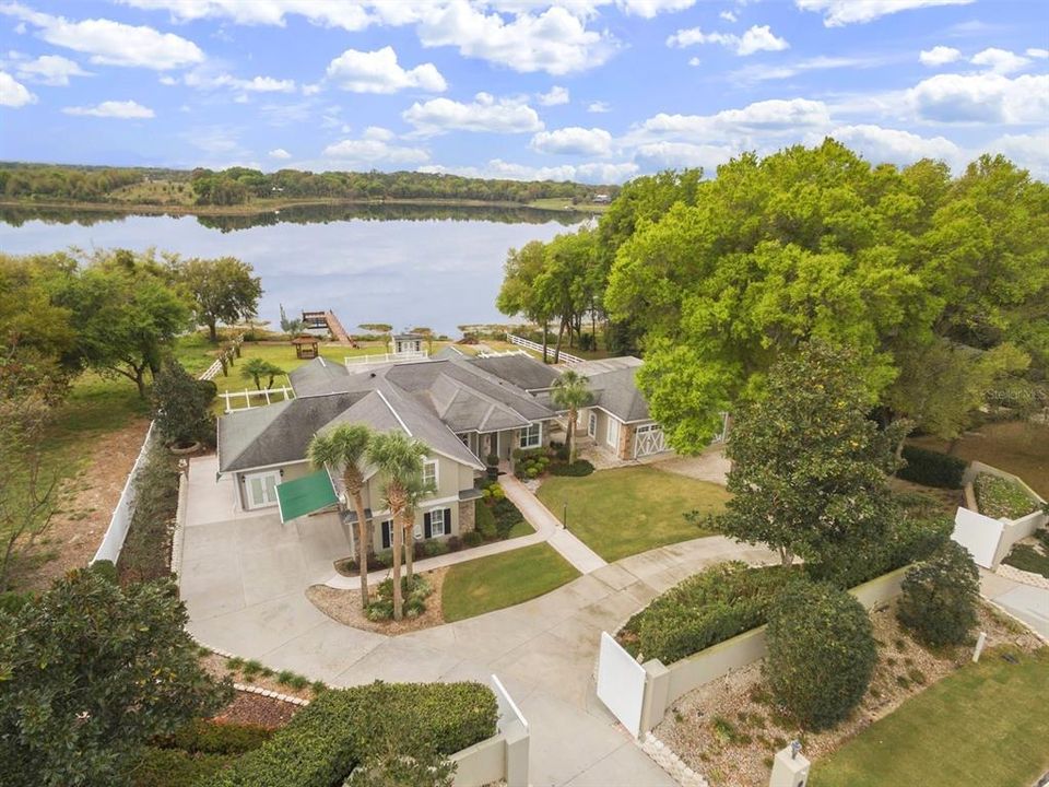 Aerial showing East Lake and main exterior of home