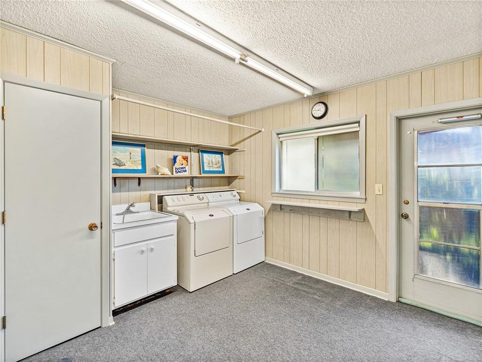 Large laundry room with exterior entrance