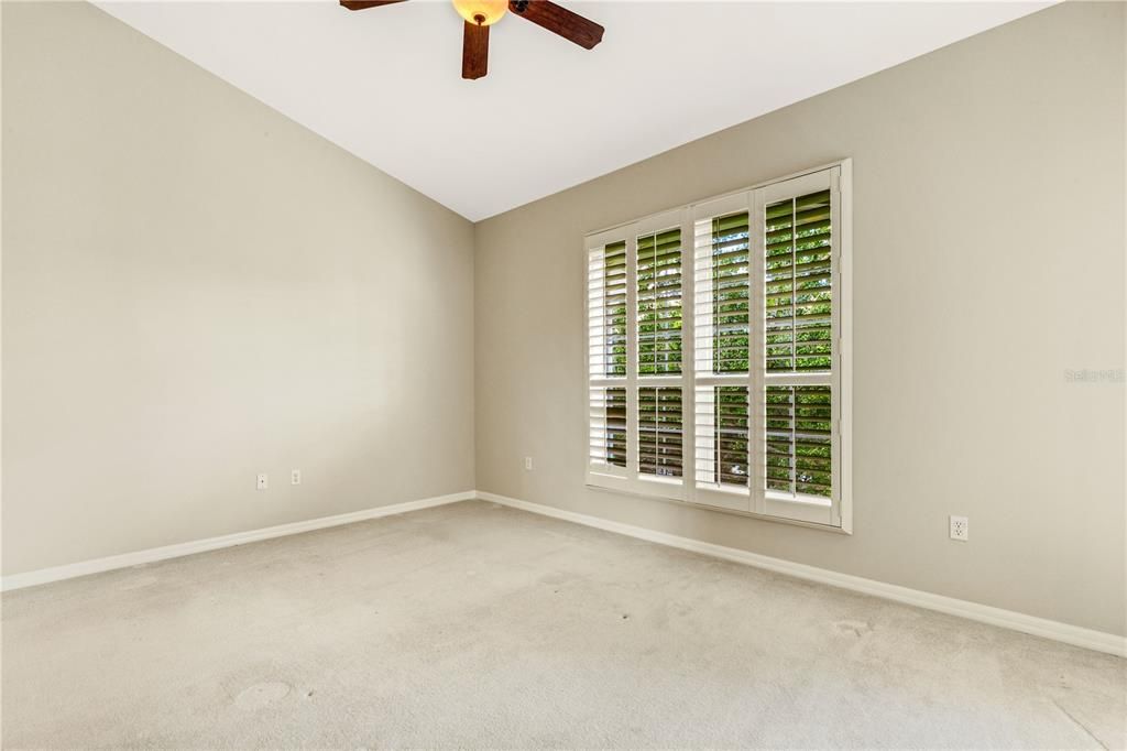 A large window with plantation shutters.