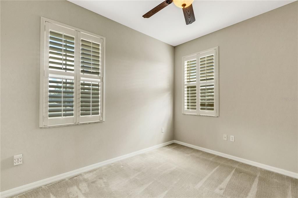Secondary bedrooms are spacious and boast plush carpet and plantation shutters.